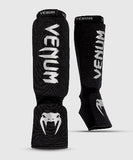 VENUM-0480-128 KONTACT ELASTIC MUAY THAI BOXING MMA SHIN GUARD PROTECTOR Baumwolle Größe ML Schwarz Silber